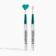 Load image into Gallery viewer, Two makeup brushes with heart-shaped ends on a white background, branded 'we love eyes'.