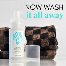 Load image into Gallery viewer, Eye makeup remover bottle with text 'Now wash it all away' and a checkered towel in the background.