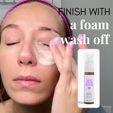 Load image into Gallery viewer, Woman applying a foam wash-off product to her face with a bottle of 'we love eyes' product displayed.