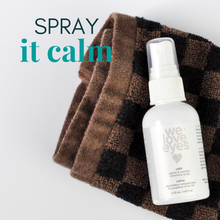 Load image into Gallery viewer, White spray bottle labeled 'we love eyes' on a brown checkered towel with text 'SPRAY it calm'.