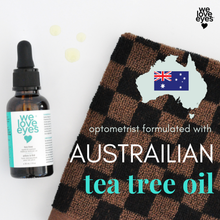 Load image into Gallery viewer, Bottle of 'we love eyes' eye oil with a checkered towel on a white background