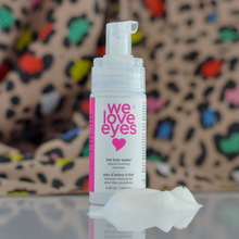 Load image into Gallery viewer, Skincare product labeled 'we love eyes' with a colorful leopard print background
